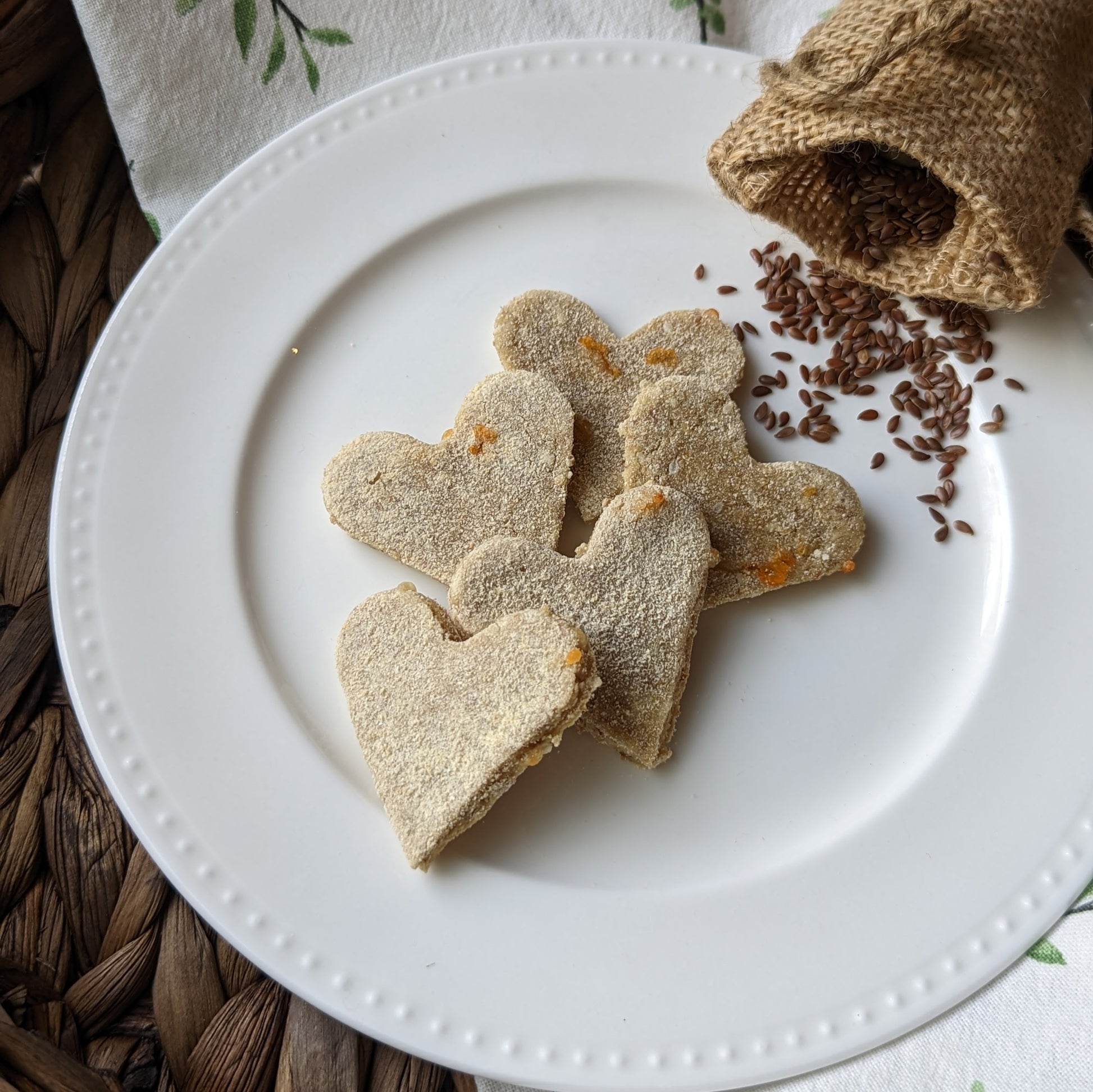 A plate of heart-shaped dog cookies
